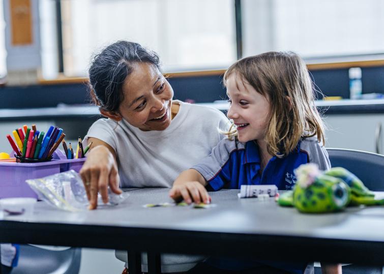 Teacher at Bairnsdale Christian College nurturing a student in a Christ-centered environment, reflecting God’s unconditional love and creating a sense of belonging and security.