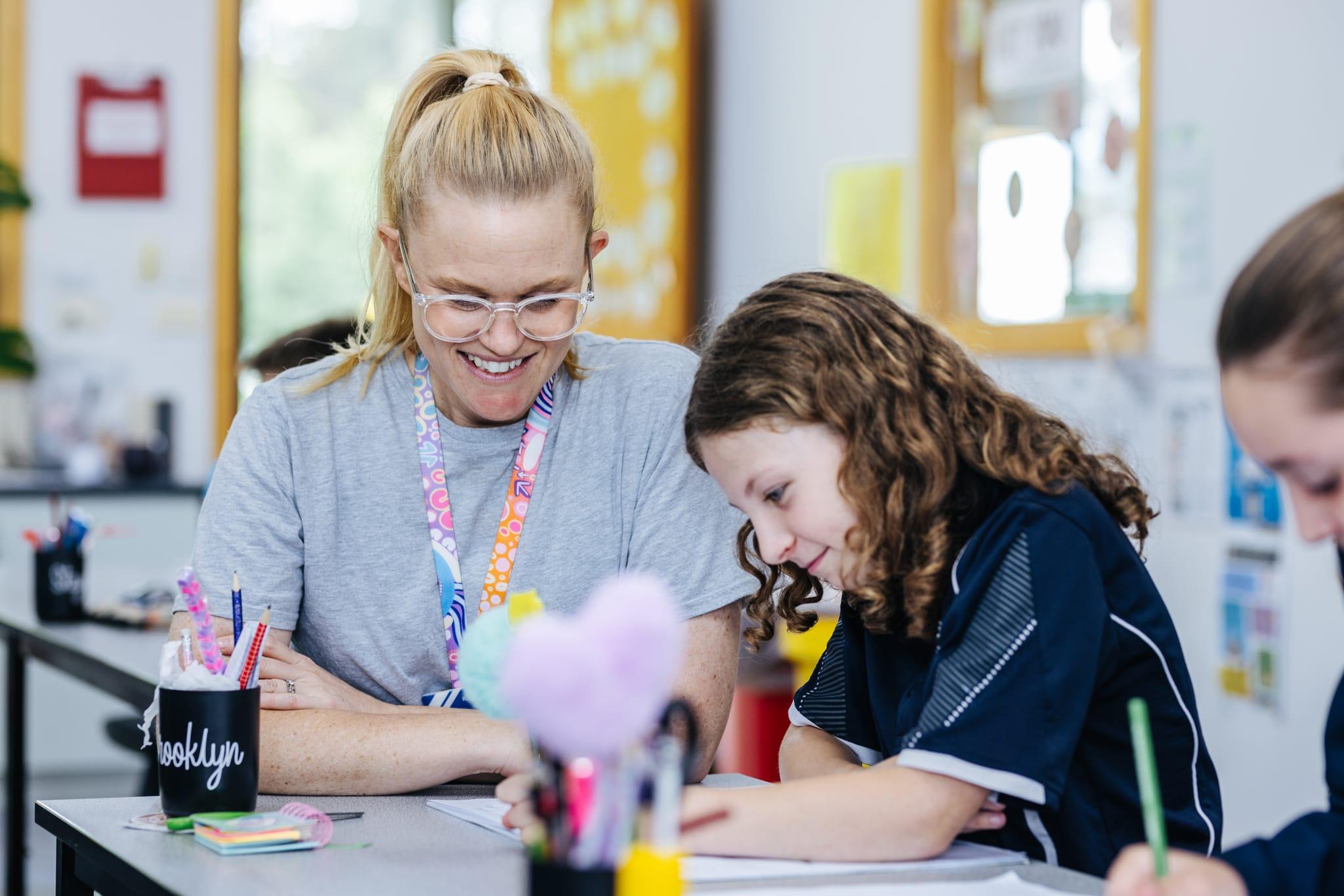 Two students engaged and smiling during a classroom discussion at Bairnsdale Christian College.